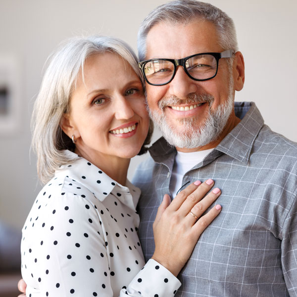 An elderly couple is delighted after receiving a smile makeover treatment in Flagstaff, AZ.
