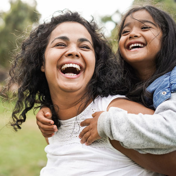 Mother holding his child with happy smile in Flagstaff, AZ