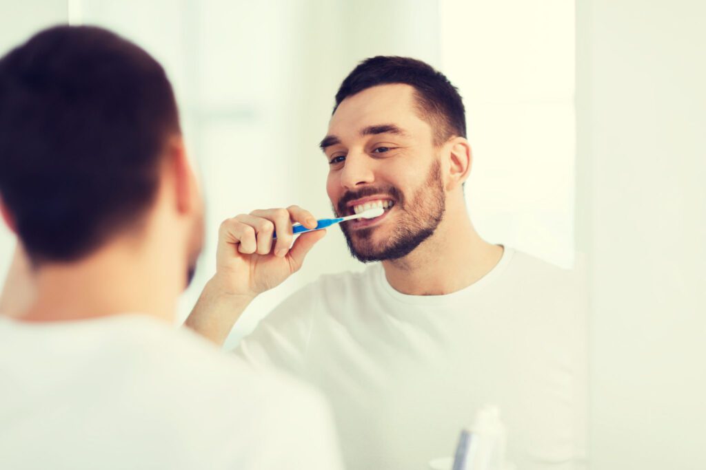 The man doing brushing by seeing mirror at Flagstaff, AZ