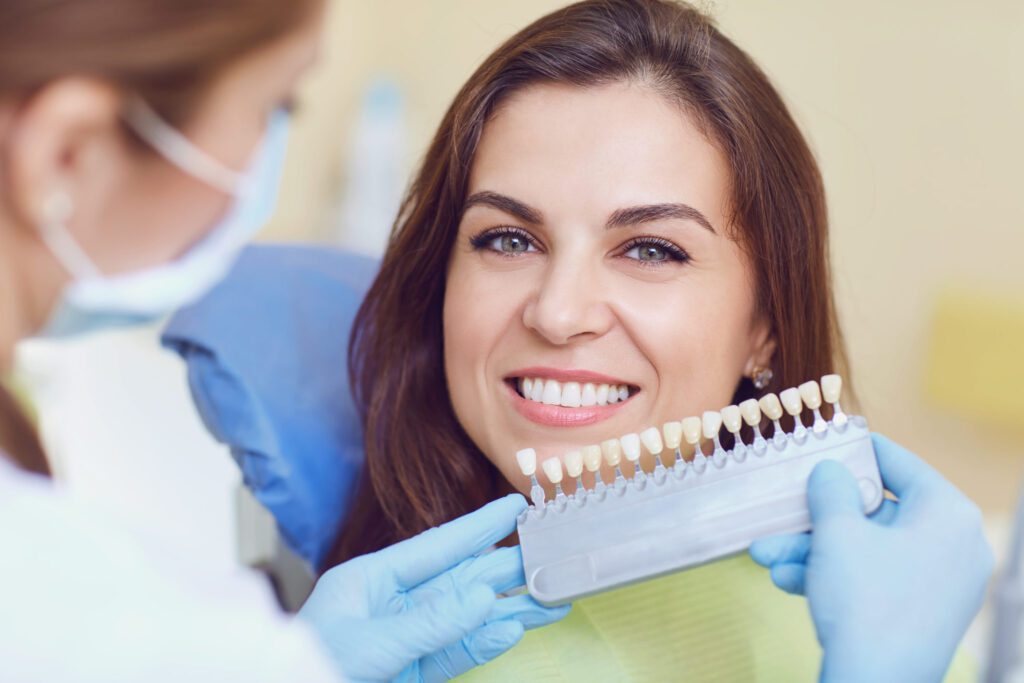Dentist doing Teeth whitening treatment for a girl at Flagstaff, AZ