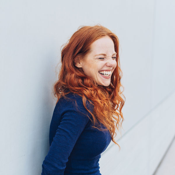 red-haired adult woman smiling