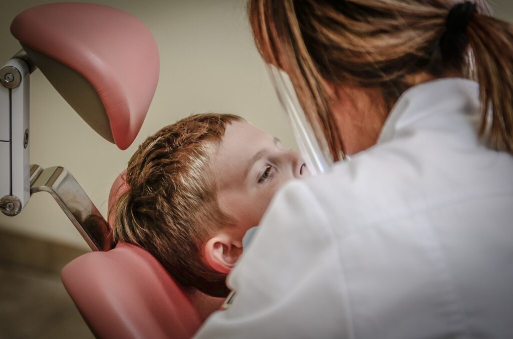Dentist checking teeth for boy at Flagstaff, AZ